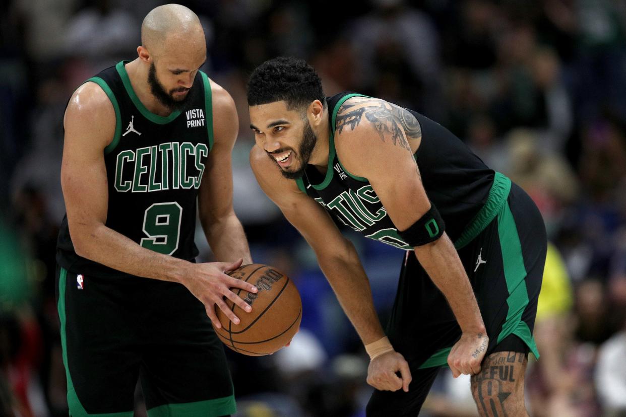 NEW ORLEANS, LOUISIANA - MARCH 30: Derrick White #9 of the Boston Celtics and Jayson Tatum #0 of the Boston Celtics react after defeating the New Orleans Pelicans during an NBA game at Smoothie King Center on March 30, 2024 in New Orleans, Louisiana. NOTE TO USER: User expressly acknowledges and agrees that, by downloading and or using this photograph, User is consenting to the terms and conditions of the Getty Images License Agreement. (Photo by Sean Gardner/Getty Images)