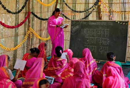 Sheetal Prakash More (R), a 30-year-old teacher, teaches at Aajibaichi Shaala (Grandmothers' School) in Fangane village, India, February 15, 2017. REUTERS/Danish Siddiqui
