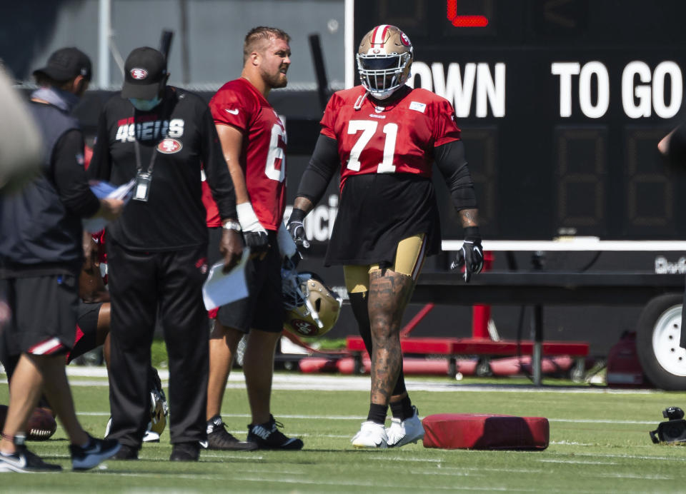 Newly acquired San Francisco 49ers offensive tackle Trent Williams (71), right, trains during NFL Training Camp practice Saturday, Aug. 15, 2020, at the SAP Performance Facility in Santa Clara, Calif. (Xavier Mascarenas/The Sacramento Bee via AP)