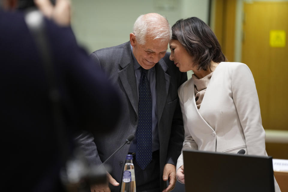 Germany's Foreign Minister Annalena Baerbock, right, speaks with European Union foreign policy chief Josep Borrell during a meeting of EU foreign ministers at the European Council building in Brussels on Monday, Jan. 23, 2023. (AP Photo/Virginia Mayo)