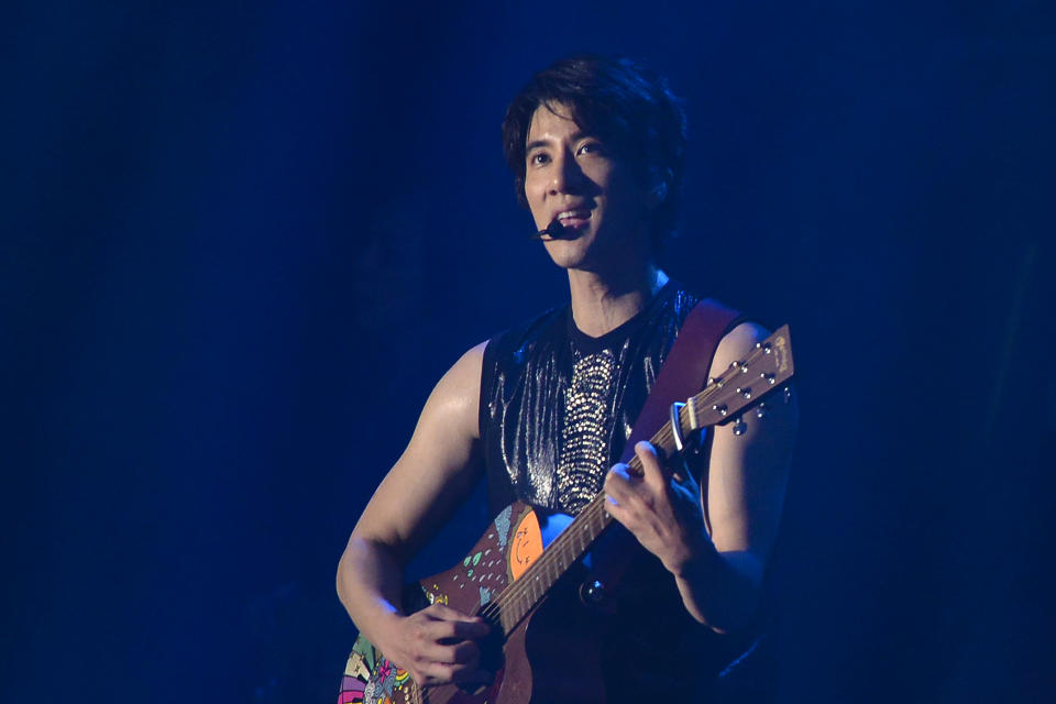 Wang Leehom, an American songwriter and singer performs on stage during his solo concert in Nanjing in east China's Jiangsu province on May 20, 2018. Wang, who is one of the biggest pop stars in China apologized to his family and fans on Monday and said he would take a break from performing after a public dispute on social media with his ex-wife, who accused him of infidelity and hiring prostitutes. (Chinatopix via AP)