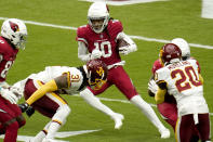 Arizona Cardinals wide receiver DeAndre Hopkins (10) tries to elude Washington Football Team safety Kamren Curl (31) during the first half of an NFL football game, Sunday, Sept. 20, 2020, in Glendale, Ariz. (AP Photo/Ross D. Franklin)