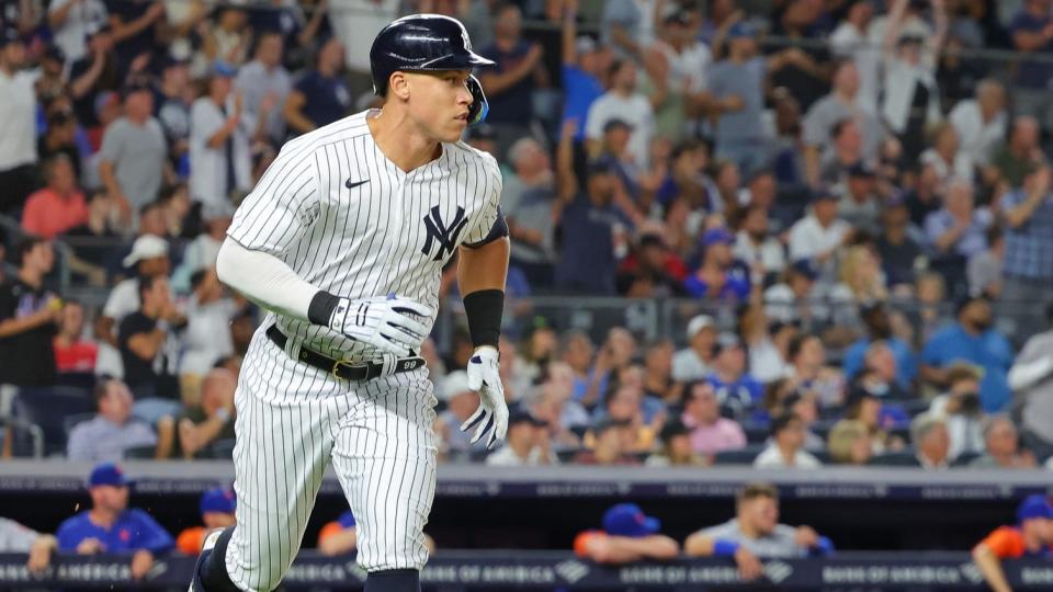 August 23, 2022;  Bronx, New York, USA;  New York Yankees right fielder Aaron Judge (99) watches his RBI single during the seventh inning against the New York Mets at Yankee Stadium.