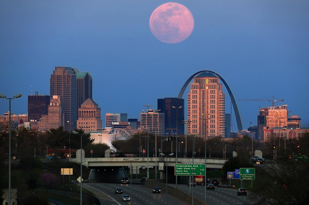 The pink supermoon rises over St. Louis on Tuesday, April 7, 2020. April's supermoon is the brightest and largest it will be for all of 2020. (David Carson/St. Louis Post-Dispatch via AP)
