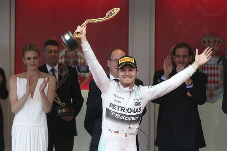 Mercedes Formula One driver Nico Rosberg of Germany celebrates on the podium after winning the Monaco F1 Grand Prix in Monaco May 24, 2015. REUTERS/Stefano Rellandini