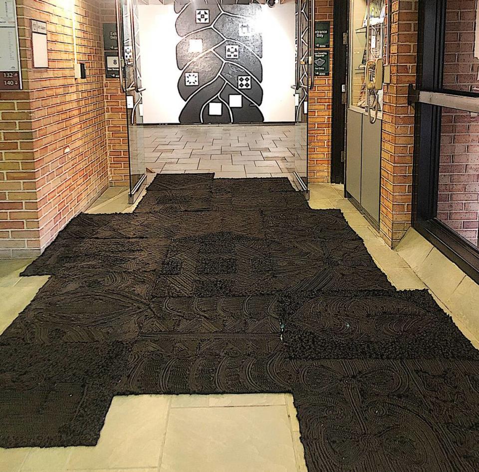 Subtle Oppression: This multiple panel work composed of natural braiding hair and twists mounted on felt is displayed on the floor of galleries for viewers to walk on or intentionally step around.