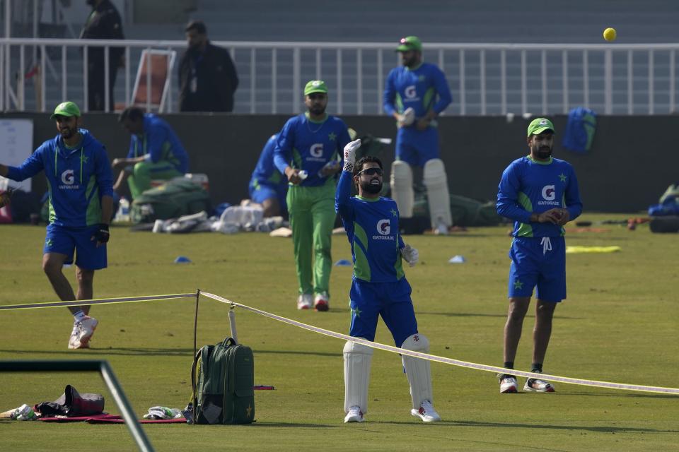 Pakistan's Mohammad Rizwan, center, and teammates attend a training session, in Rawalpindi, Pakistan, Monday, Nov. 28, 2022. Pakistan and England teams will play three-test cricket matches starting from Dec. 1. (AP Photo/Anjum Naveed)