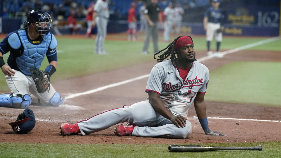 Washington Nationals' Josh Bell (19) reacts after being tagged out by Tampa Bay Rays catcher Mike Zunino while trying to score on a single by Josh Harrison during the seventh inning of a baseball game Tuesday, June 8, 2021, in St. Petersburg, Fla. (AP Photo/Chris O'Meara)