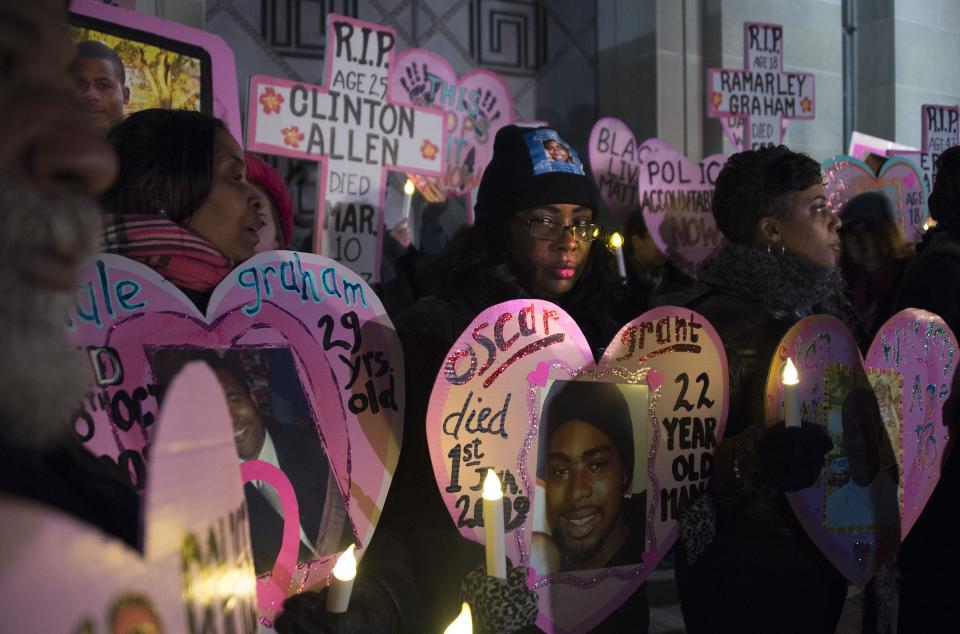 Wanda Johnson (center), whose son Oscar Grant was fatally shot in 2009 by a police officer in Oakland, California, stands with others during a vigil in Washington, D.C., on Dec. 10, 2014. | Jim Watson/AFP—Getty Images