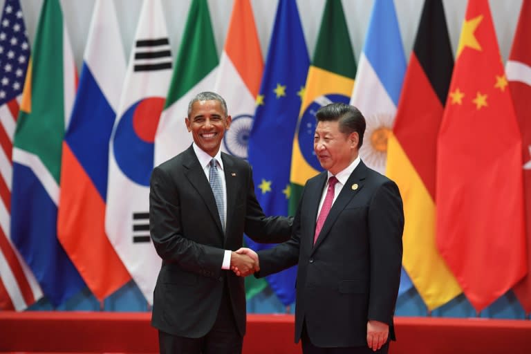 China's President Xi Jinping (R) shaking hands with US President Barack Obama before the G20 leaders' family photo in Hangzhou on September 4, 2016