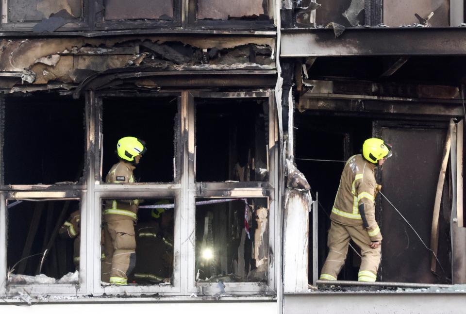 Firefighters work at a damaged residential building in East LondonREUTERS