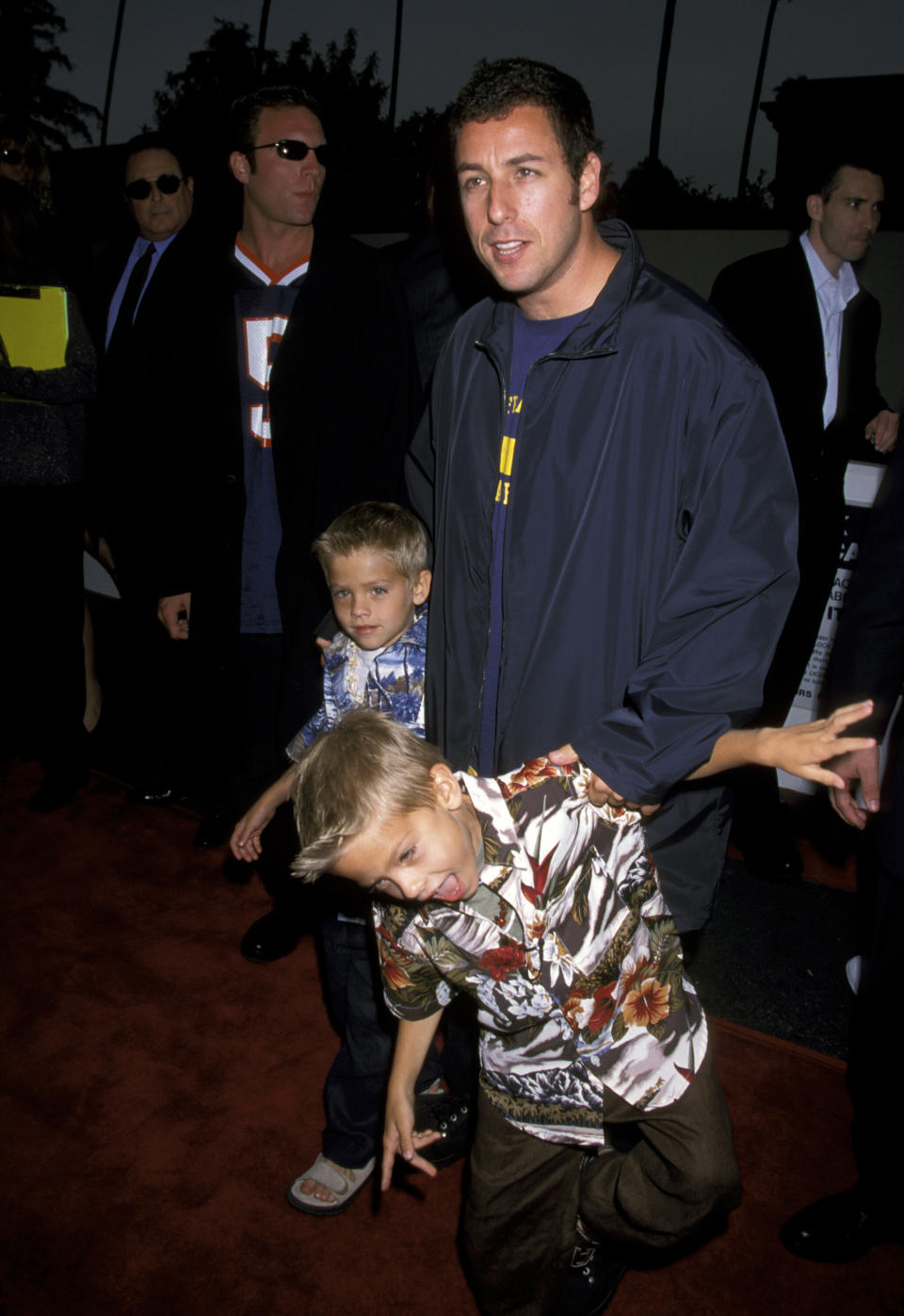 Adam Sandler, Cole Sprouse and Dylan Sprouse at the Avco Cinema in Westwood, California, in 1999. (Photo: Jim Smeal via Getty Images)