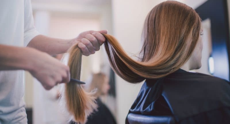 A bridesmaid has sparked anger after cutting her hair ahead of her friend's wedding. [Photo: Getty]