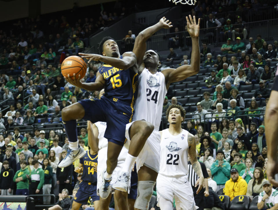 California guard Jalen Cone (15), shoots against Oregon forward Mahamadou Diawara (24), during the second half of an NCAA college basketball game in Eugene, Ore., Saturday, Jan. 13, 2024. (AP Photo/Thomas Boyd)