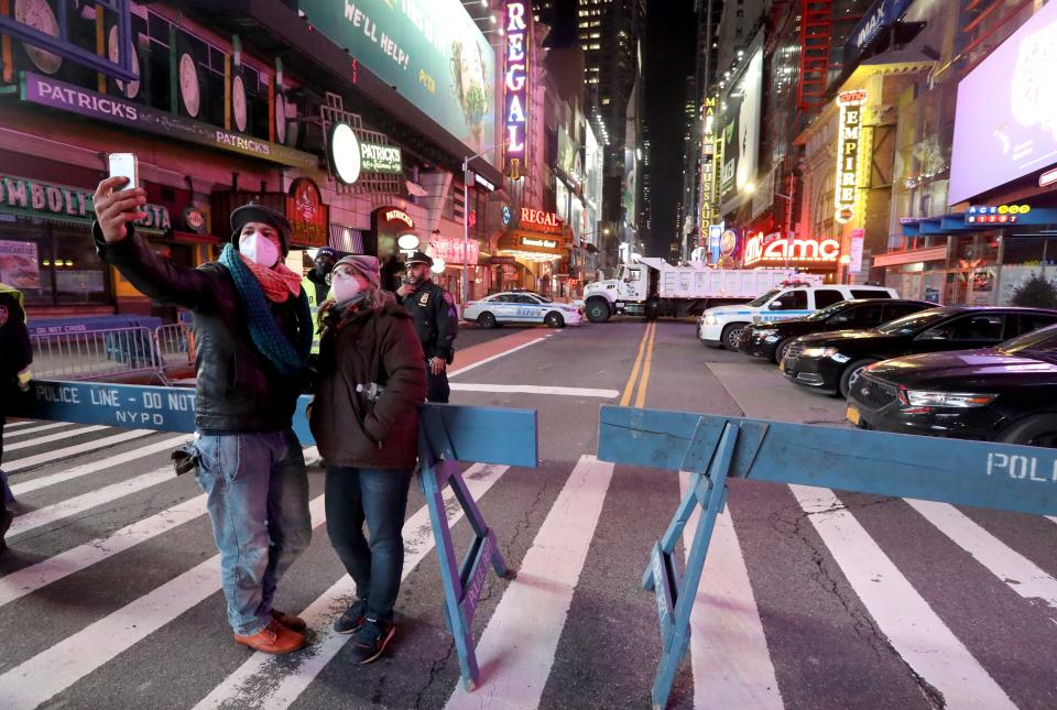 With Times Square in Manhattan closed to those wishing to watch the ball drop due to COVID-19 restrictions, thousands took to nearby streets to celebrate New Year's Eve in New York City on Dec. 31, 2020.