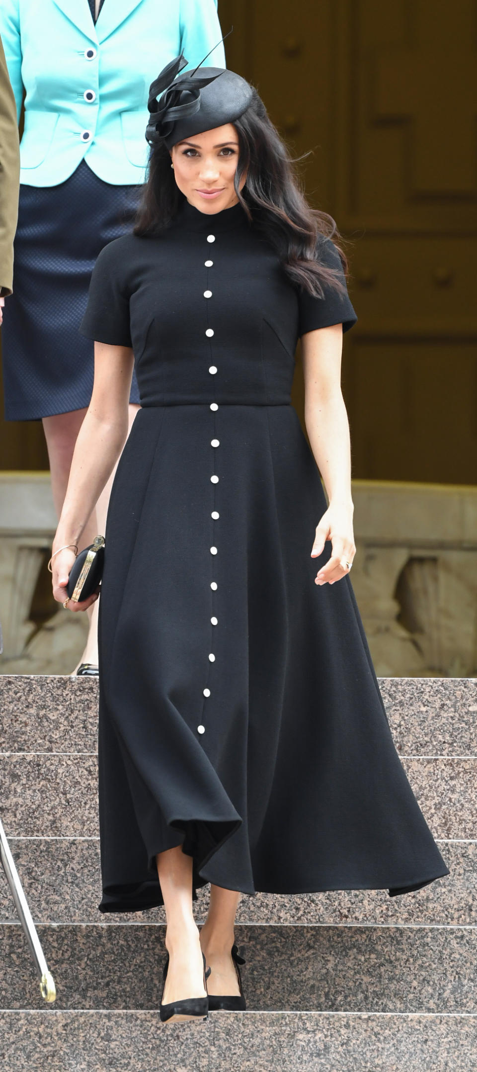 <p>Prince Harry was dressed in his full military uniform, whilst Meghan Markle wore a stunning black dress by New Zealand designer <a rel="nofollow noopener" href="https://www.matchesfashion.com/au/products/1221217?rffrid=sem.Google.n=g.cid=919463167.aid=50012969470.k=.mty=.d=c.adp=1o1.cr=218724004203.tid=aud-428184845686:pla-349688439582.pid=1221217000008.ppid=349688439582.lpm=9071790.adty=pla.prl=en&utm_content=1221217000008&utm_term=349688439582.[value].&gclid=EAIaIQobChMInrHnovaT3gIVBAUqCh1oIwp0EAYYASABEgLesvD_BwE&gclsrc=aw.ds" target="_blank" data-ylk="slk:Emilia Wickstead which retails for $2600;elm:context_link;itc:0;sec:content-canvas" class="link ">Emilia Wickstead which retails for $2600</a>.<br>The Duchess of Sussex wasn’t wearing any Australian designers for her first appearance of the day, but her chosen designer for her dress may have been a subtle tribute to the military coalition between Australia and New Zealand.<br>Meghan paired her dress with a pair of <a rel="nofollow noopener" href="https://www.bloomingdales.com/buy/tabitha-simmons" target="_blank" data-ylk="slk:Tabitha Simmons;elm:context_link;itc:0;sec:content-canvas" class="link ">Tabitha Simmons</a> heels which retail for $1000 and a satin <a rel="nofollow noopener" href="https://www.givenchy.com/apac/en/satin-clutch-with-jewelry-clasp/BB5014B02F-001.html?cgid=POUCH_W-1#start=1" target="_blank" data-ylk="slk:Givenchy clutch;elm:context_link;itc:0;sec:content-canvas" class="link ">Givenchy clutch</a> which retails for $2600. Source: Getty </p>