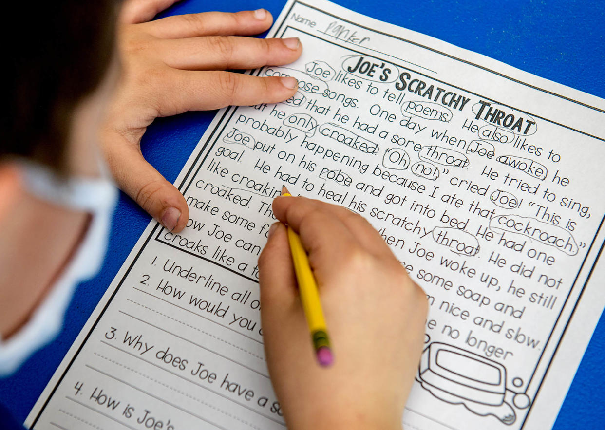 Central Primary School third-grader Parker Meinders works diligently through a phonics comprehension lesson with special