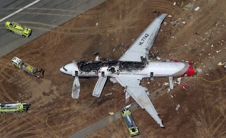 FILE PHOTO: An Asiana Airlines Boeing 777 plane is seen in this aerial image after it crashed while landing at San Francisco International Airport in California