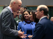 French Junior Minister for European Affairs Amelie de Montchalin, second right, speaks with Slovak State Secretary at the Foreign Ministry Frantisek Ruzicka, second left, during a meeting of EU General Affairs ministers at the European Council building in Brussels, Tuesday, Feb. 25, 2020. European Union ministers are putting the final touches on the mandate that will be the guide for EU negotiator Michel Barnier as he sits own with UK officials to thrash out a free trade deal over the next ten months. At center is Czech Republic's Secretary of State for European Affairs Milena Hrdinkova. (AP Photo/Virginia Mayo)