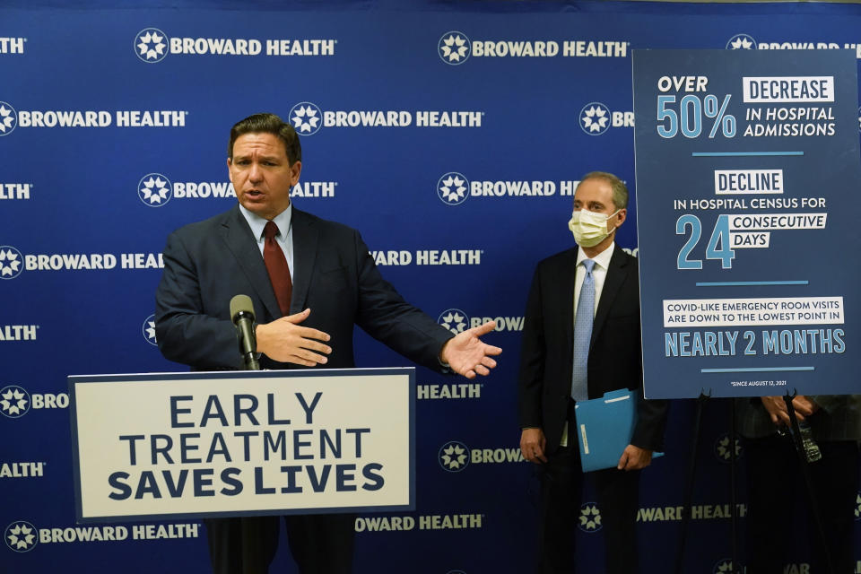 Florida Gov. Ron DeSantis, left, speaks at a news conference alongside Broward Health CEO Shane Strum, Thursday, Sept. 16, 2021, at the Broward Health Medical Center in Fort Lauderdale, Fla. DeSantis was there to promote the use of monoclonal antibody treatments for those infected with COVID-19. (AP Photo/Wilfredo Lee)