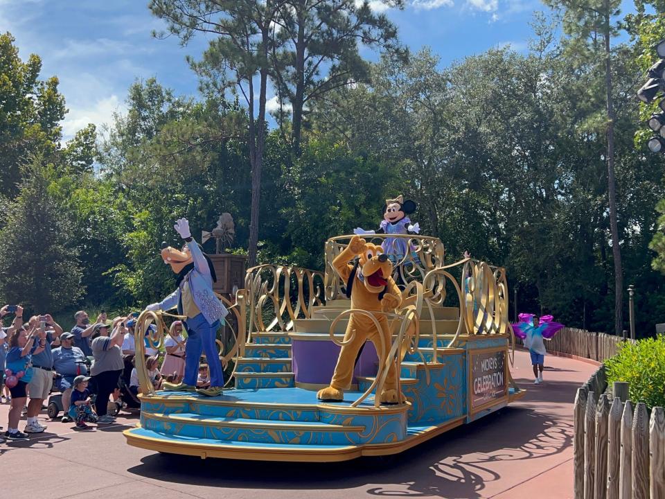 a disney world parade float starting in frontierland