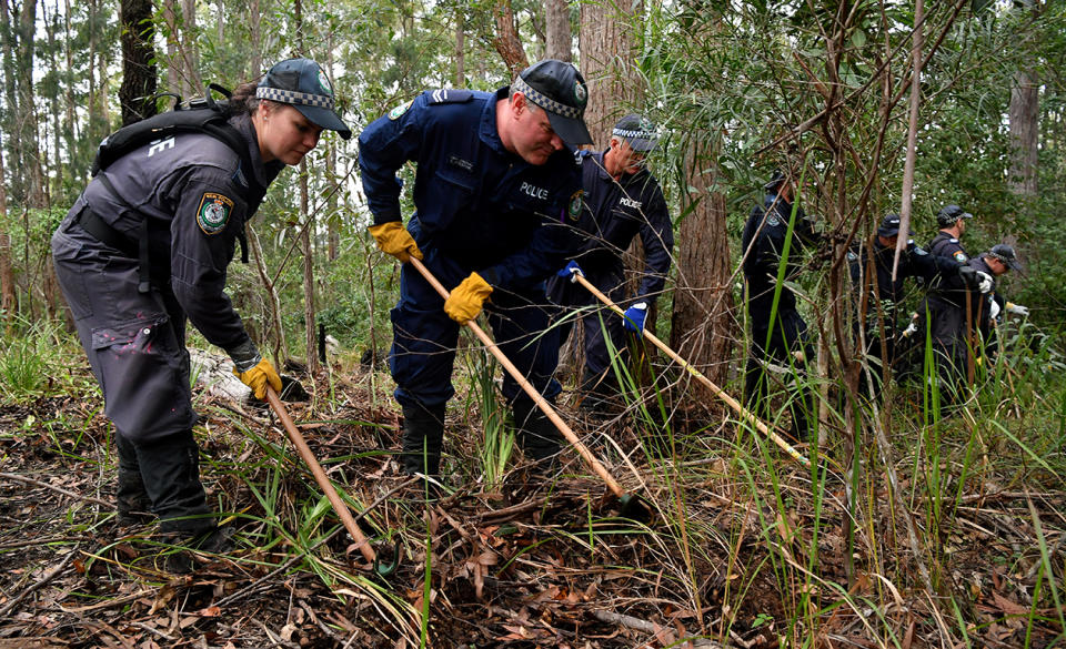 <span>Members of the NSW Public Order and Riot Squad clear bushland in Kendall on the NSW mid-north coast earlier this month. Source: AAP</span>