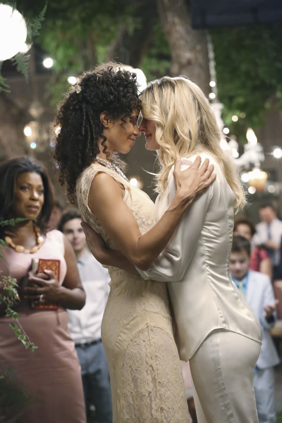 <p>The season finale of ABC's <em>The Fosters</em> was the first show to feature a same-sex wedding since the overturning of DOMA, the Defense of Marriage Act. On the episode, appropriately named "I do," moms Stef and Lena tied the knot. According to <em>TV Guide</em>, who interviewed the show's executive producers, the episode was written and planned long before the historic decisions on Prop 8 and DOMA were made by the Supreme Court. </p><p>"We knew the Supreme Court would likely make its decision before we shot [the episode]," <a href="https://www.tvguide.com/news/abc-familys-fosters-gay-wedding-1068890/#:~:text=ABC%20Family's%20The%20Fosters%20makes,landmark%20ruling%20on%20gay%20marriage." rel="nofollow noopener" target="_blank" data-ylk="slk:Executive Producer Peter Paige told TV Guide;elm:context_link;itc:0;sec:content-canvas" class="link ">Executive Producer Peter Paige told <em>TV Guide</em></a> in 2013. "If they had ruled the other way we would have still gone ahead—only with an f--k you wedding! But because the Court did rule the way it did, it was an even more resonant celebration."</p>