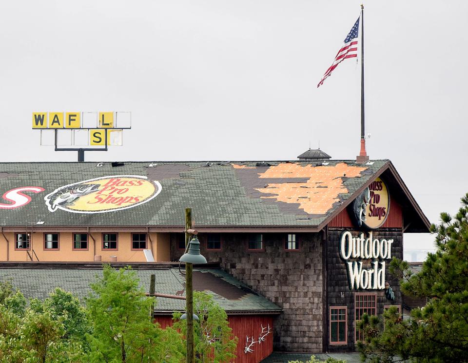 Damaged roofs and signs are seen as cleanup work continues on Wednesday May 5, 2021 in Prattville, Ala., after a storm hit the area on Tuesday evening. 