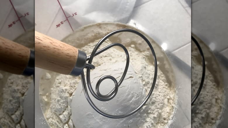 danish dough whisk over bowl with dough