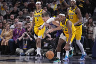 Indiana Pacers' Buddy Hield (24) and Sacramento Kings' Domantas Sabonis (10) battle for the ball during the second half of an NBA basketball game, Friday, Feb. 3, 2023, in Indianapolis. (AP Photo/Darron Cummings)