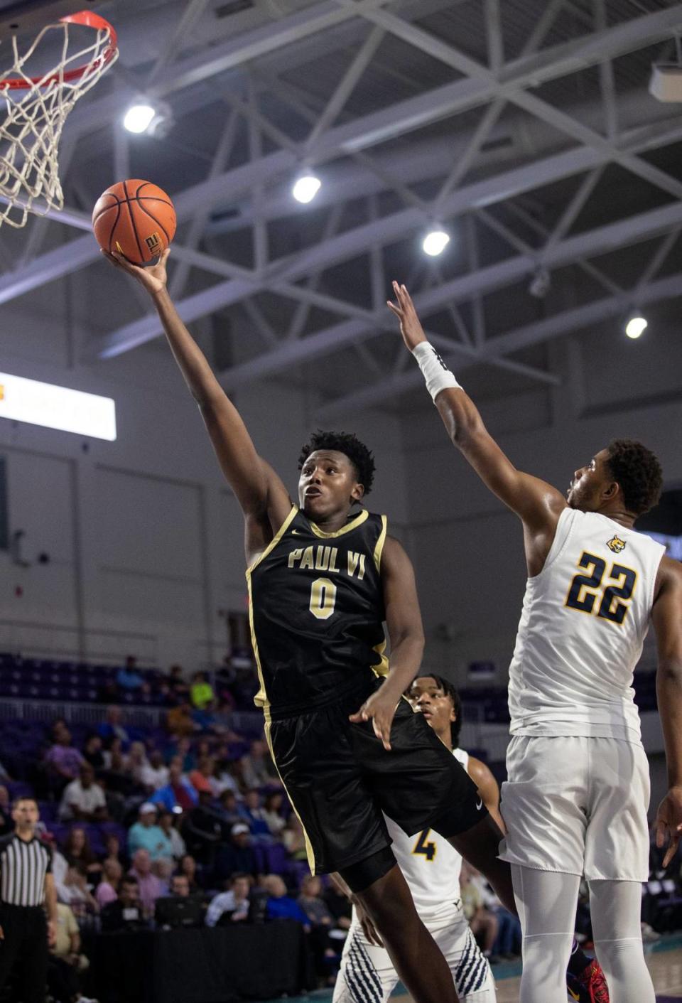 Patrick Ngongba goes up for a shot against Wheeler in the City of Palms Classic third-place game on Dec. 21, 2022, at Suncoast Credit Union Arena in Fort Myers. Ngongba recently finished a recruiting visit to Kentucky.