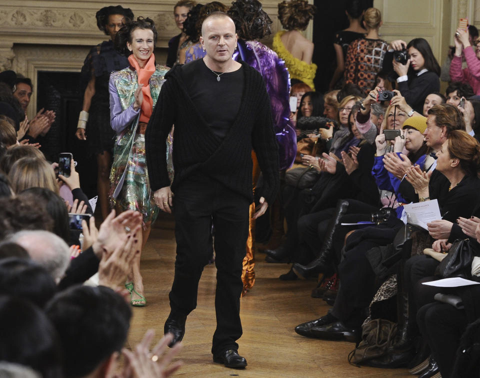 Fashion designer Maurizio Galante greats the audience after his Spring/Summer 2013 Haute Couture fashion collection, presented in Paris, Monday, Jan. 21, 2013. (AP Photo/Zacharie Scheurer)