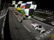 FORT WORTH, TX - NOVEMBER 04: Kevin Harvick, driver of the #2 Hunt Brothers Pizza Chevrolet, heads towards the start finish line to take the checkered flag and win the NASCAR Camping World Truck Series WinStar World Casino 350k at Texas Motor Speedway on November 4, 2011 in Fort Worth, Texas. (Photo by Jared C. Tilton/Getty Images for NASCAR)