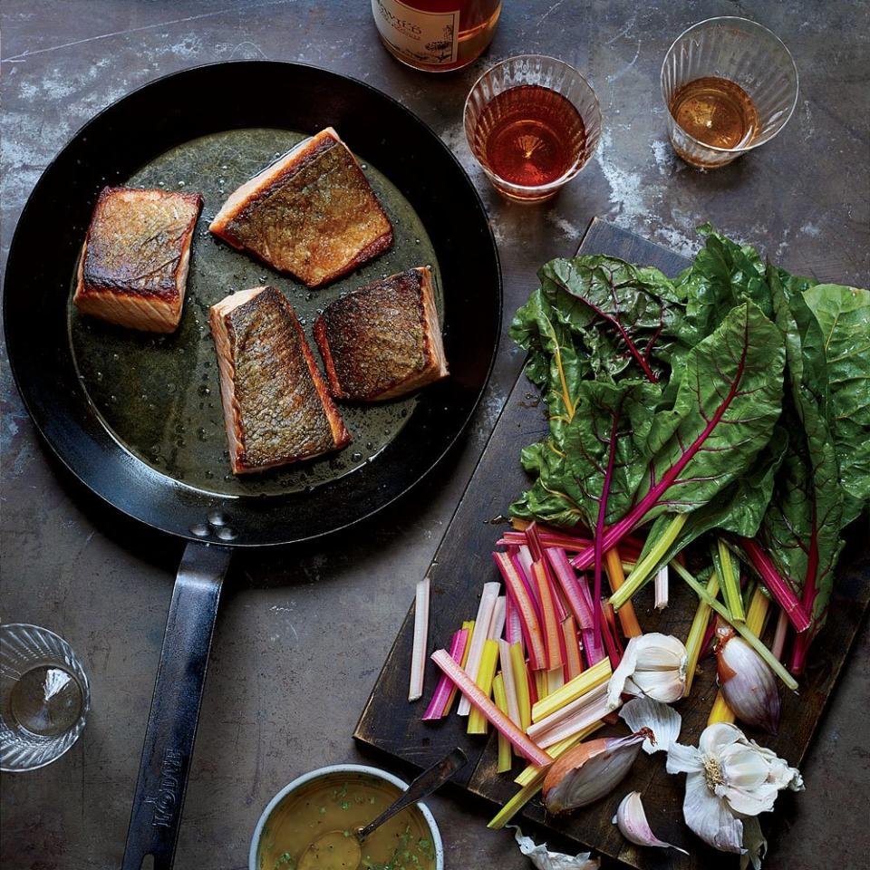 <p>Economy is a beautiful thing: <em>Food & Wine</em> test kitchen deputy editor Justin Chapple’s tarragon vinaigrette flavors both earthy chard and buttery pan-seared salmon.</p><p><a href="https://www.foodandwine.com/recipes/crispy-salmon-and-wilted-chard" rel="nofollow noopener" target="_blank" data-ylk="slk:GO TO RECIPE;elm:context_link;itc:0" class="link ">GO TO RECIPE</a></p>