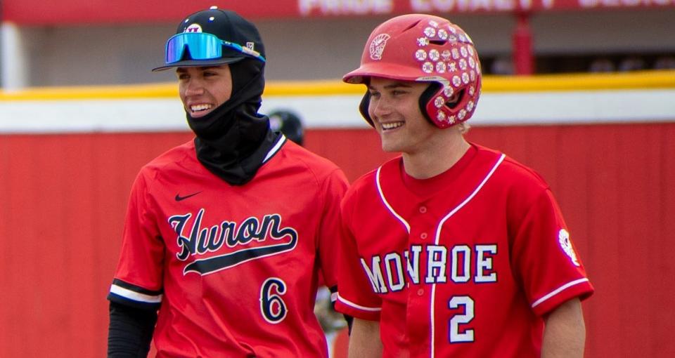 Longtime friends Tyler Ramsby of New Boston Huron and Logan Loveland of Monroe share a laugh during Huron's 12-5 and 19-11 doubleheader sweep on Saturday, April 20, 2024.