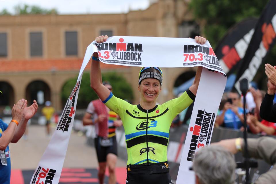 Jana Richtrova celebrates being the first female finisher during the 2021 IRONMAN 70.3 Lubbock. IRONMAN, the owner and producer of the Lubbock event, announced Friday it's discontinuing the annual June race.