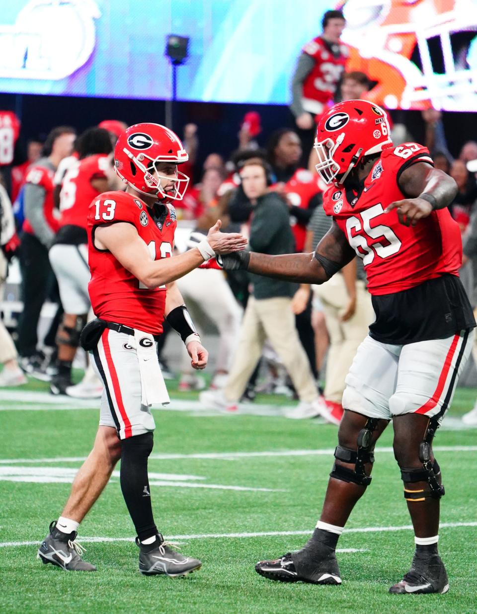 The Bengals drafting  Georgia offensive tackle Amarius Mims instead of perhaps trading up for a defensive lineman, runs counter to a "win now" mentality, Jason Williams writes.