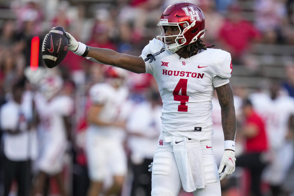 Houston wide receiver Samuel Brown signals a first down after his reception during the first half of an NCAA college football game against Rice, Saturday, Sept. 9, 2023, in Houston. (AP Photo/Eric Christian Smith)