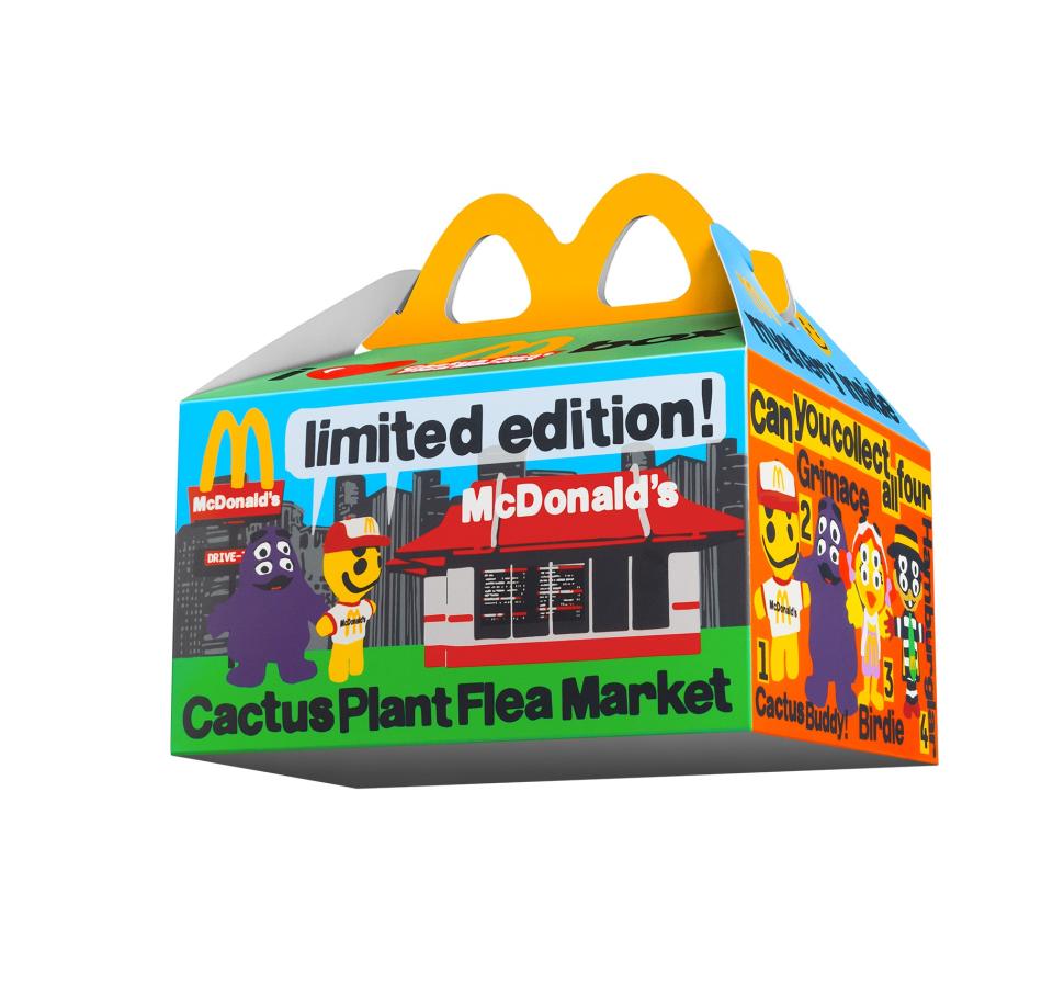 The adult Happy Meal box features colorful artwork.
