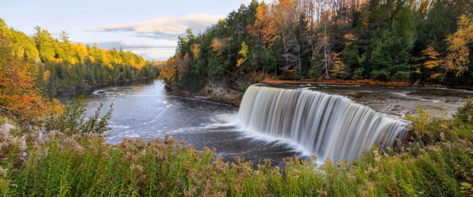 A panoramic view of the very picturesque Tahquamenon Falls and Tahquamenon River during Autumn, Upper Peninsula, Michigan, USA