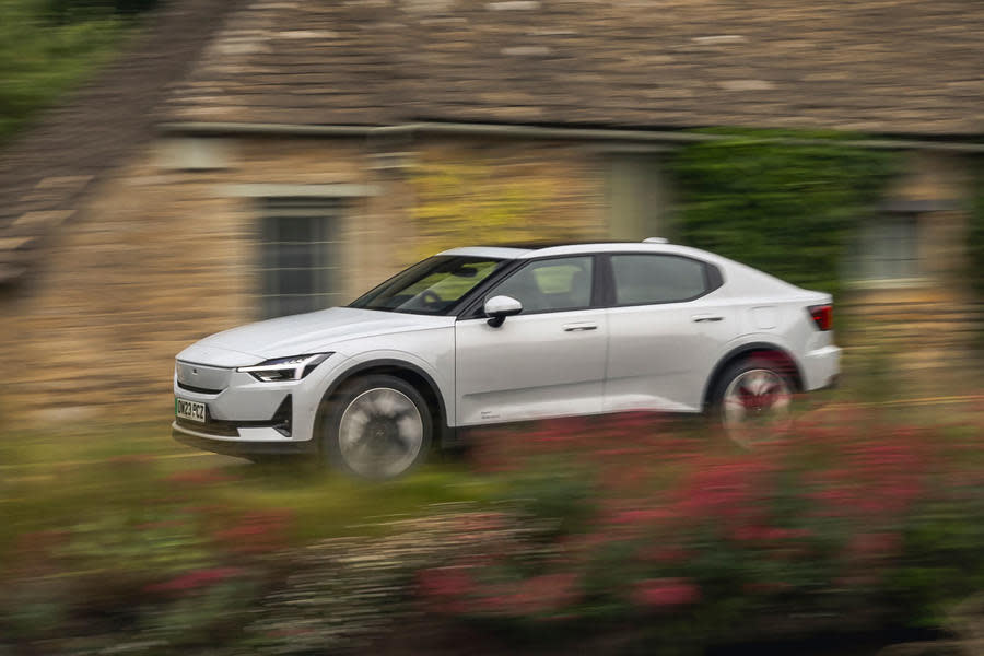 Polestar 2 driving through countryside village – front quarter