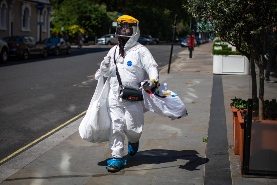 A man wearing full PPE walks through Knightsbridge, London following the introduction of measures to bring England out of lockdown. (Photo by Aaron Chown/PA Images via Getty Images)