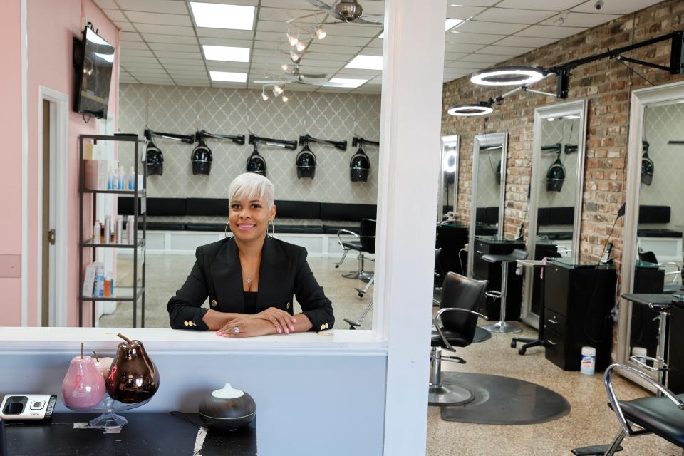 Latecka Early-Moore poses for a photo at Luxe Hair Salon.