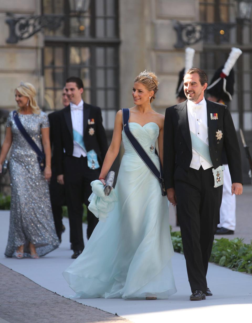 Prince Nikolaos of Greece and his wife Tatiana arrive at the Royal Chapel for the wedding of Sweden's Princess Madeleine and Christopher O'Neill, in Stockholm, Saturday June 8, 2013. (AP Photo/Soren Andersson) SWEDEN OUT