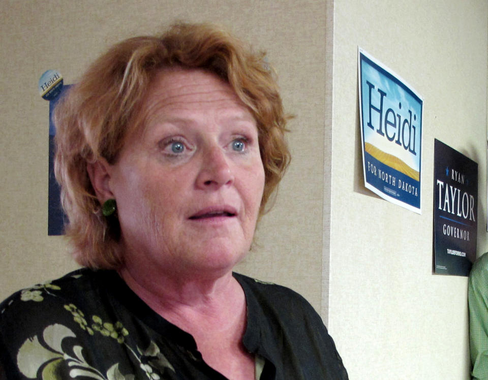 FILE -This photo Aug. 11, 2012 file photo shows North Dakota Senate candidate Heidi Heitkamp speaking in Dickinson, N.D. Senate Democrats are launching two ads in North Dakota criticizing Republican Rep. Rick Berg over the stalled farm bill. Berg is locked in a close race with Heitkamp for the open seat. (AP Photo/Dale Wetzel, File )