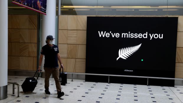 Passengers arrive from New Zealand after the Trans-Tasman travel bubble opened overnight, at Sydney Airport