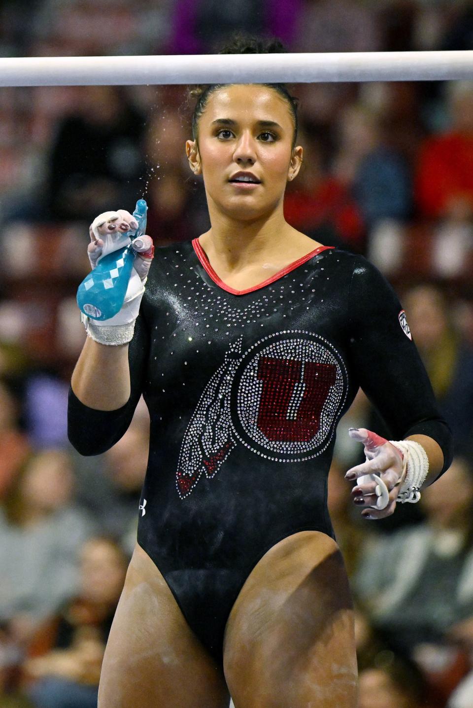 Utah’s Amelie Morgan, wets the lower bar prior to her routine as BYU, Utah, SUU and Utah State meet in the Rio Tinto Best of Utah Gymnastics competition at the Maverick Center in West Valley City on Monday, Jan. 15, 2024. | Scott G Winterton, Deseret News