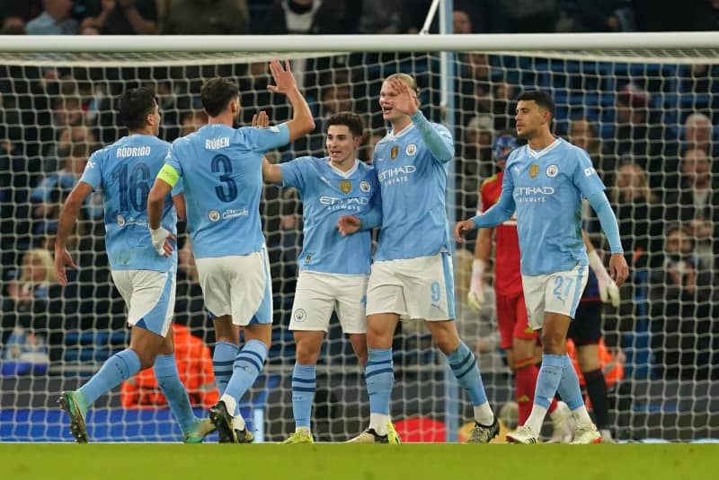 Manchester City's Erling Haaland (2nd R) celebrates scoring his side's third goal with teammates during the UEFA Champions League round of 16 second leg soccer match between Manchester City and FC Copenhagen at the Etihad Stadium. Martin Rickett/PA Wire/dpa