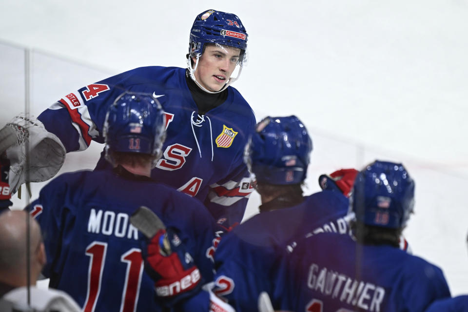 USA's Gabe Perreault celebrates scoring during the IIHF World Junior Championship ice hockey quarterfinal match between USA and Latvia at Frolundaborg in Gothenburg, Sweden, Tuesday Jan. 2, 2024. (Bjorn Larsson Rosvall/TT via AP)