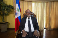 Haiti's Prime Minister Ariel Henry attends an interview with the Associated Press at his private residence in Port-au-Prince, Tuesday, Sept. 28, 2021. (AP Photo/Joseph Odelyn)